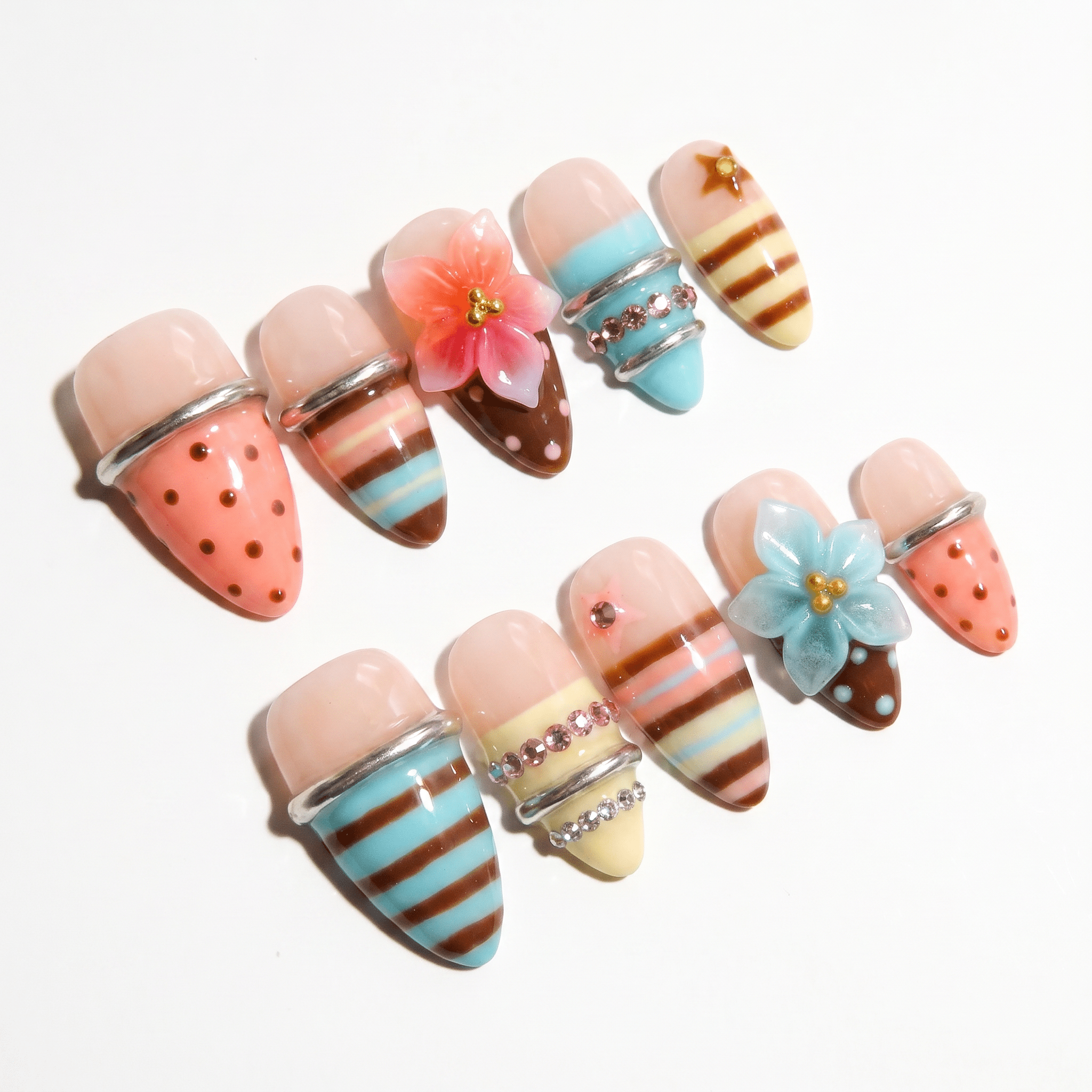 Floral Sorbet press-on nails worn on hand – almond shape by Handora
