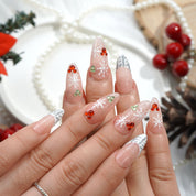Frost Kiss press-on nails worn on hand – oval shape by Handora