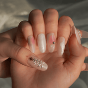 Frosted Pink press-on nails worn on hand – almond shape by Handora