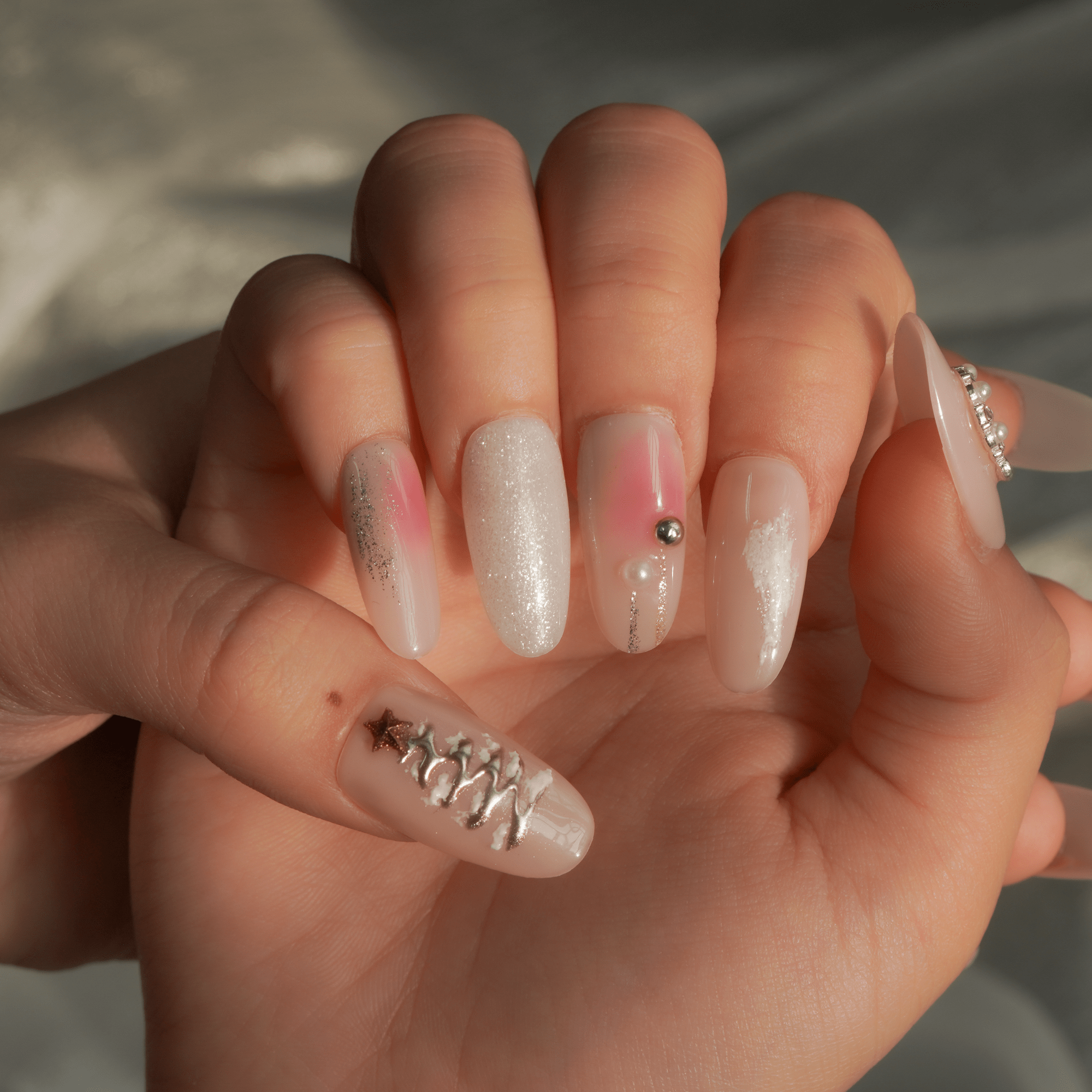 Frosted Pink press-on nails worn on hand – almond shape by Handora