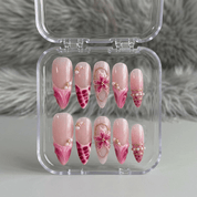 Fuchsia Flora almond press-on nails – design close-up by Handora