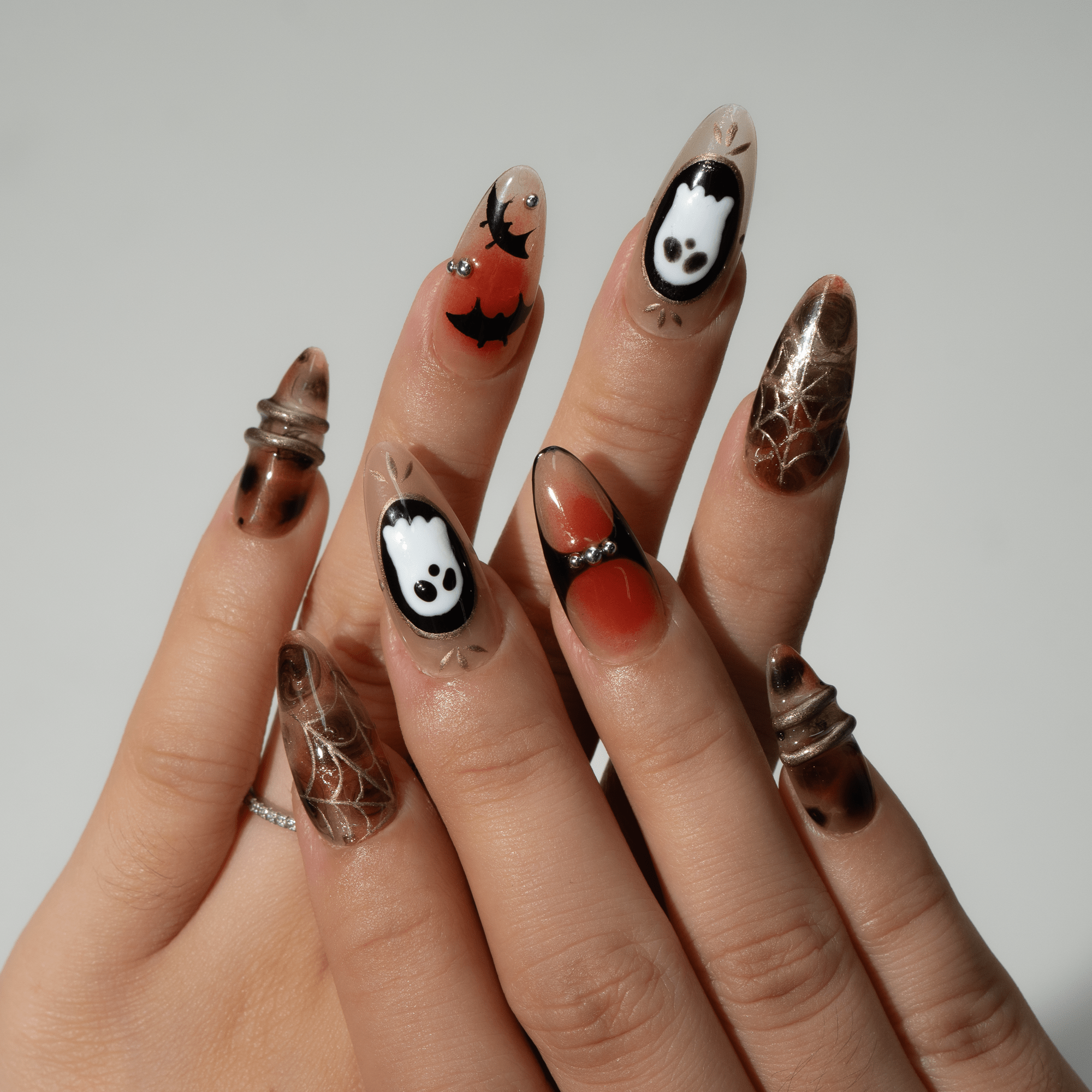 Ghost Night press-on nails worn on hand – almond shape by Handora