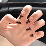 Gilded Leopard press-on nails worn on hand – almond shape by Handora