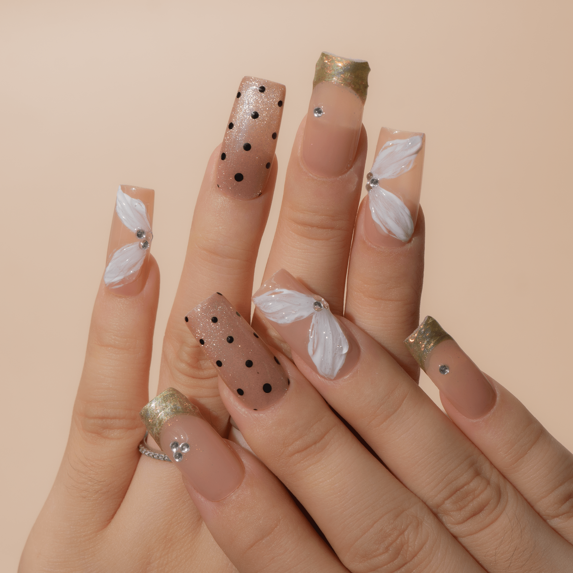 Gilded Petals press-on nails – hand-painted reusable gel set by Handora