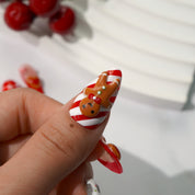Ginger Joy press-on nails worn on hand – almond shape by Handora