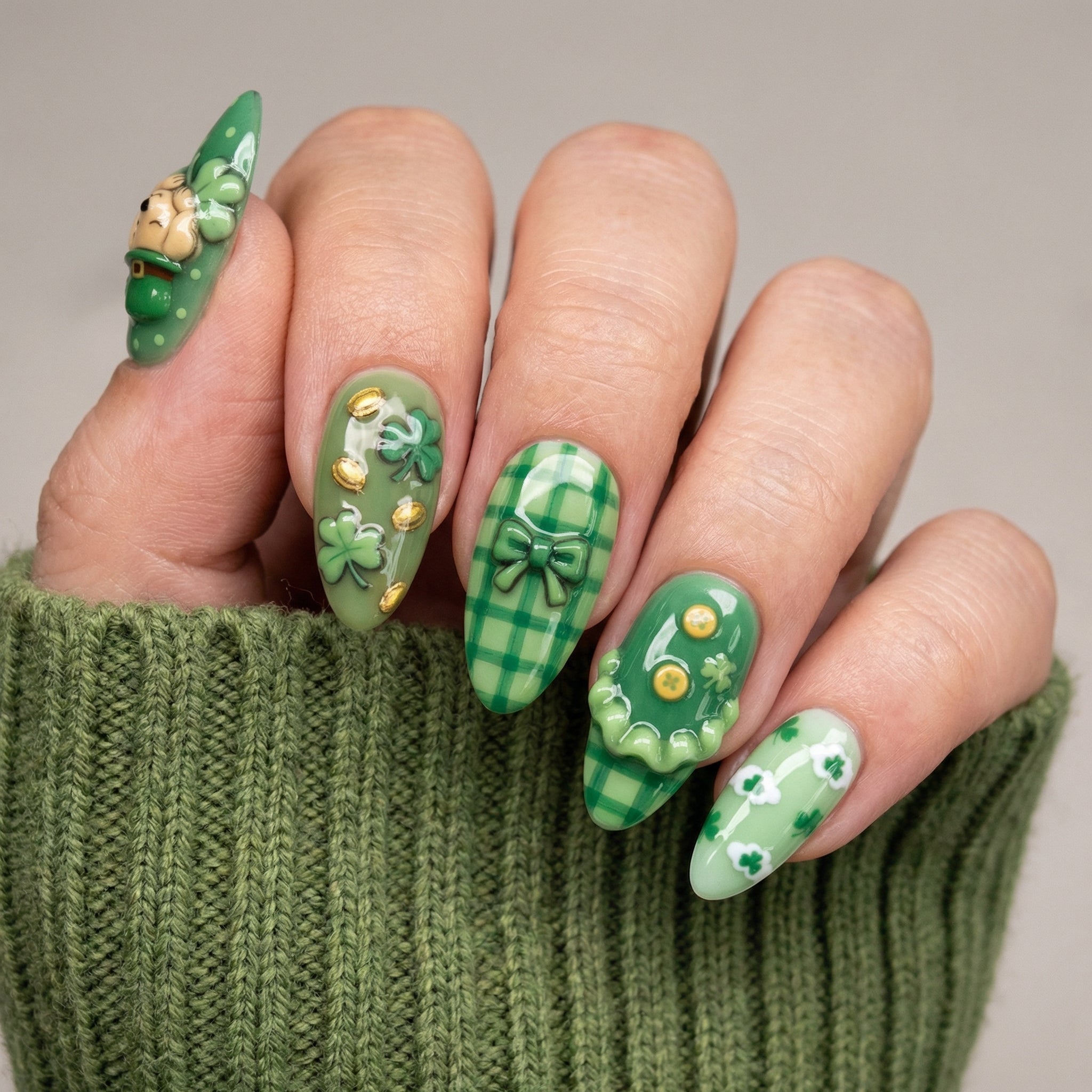 Golden Clover press-on nails worn on hand – almond shape by Handora