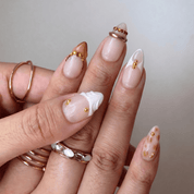 Golden Leopard press-on nails worn on hand – almond shape by Handora