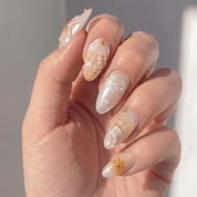 Golden Marine press-on nails – design close-up by Handora