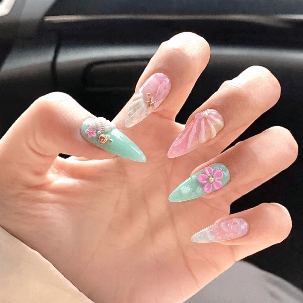 Golden Mermaid press-on nails worn on hand – stiletto shape by Handora