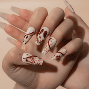 Gore Grunge press-on nails worn on hand – almond shape by Handora