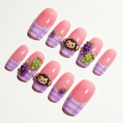 Grape Prank press-on nails worn on hand – coffin shape by Handora
