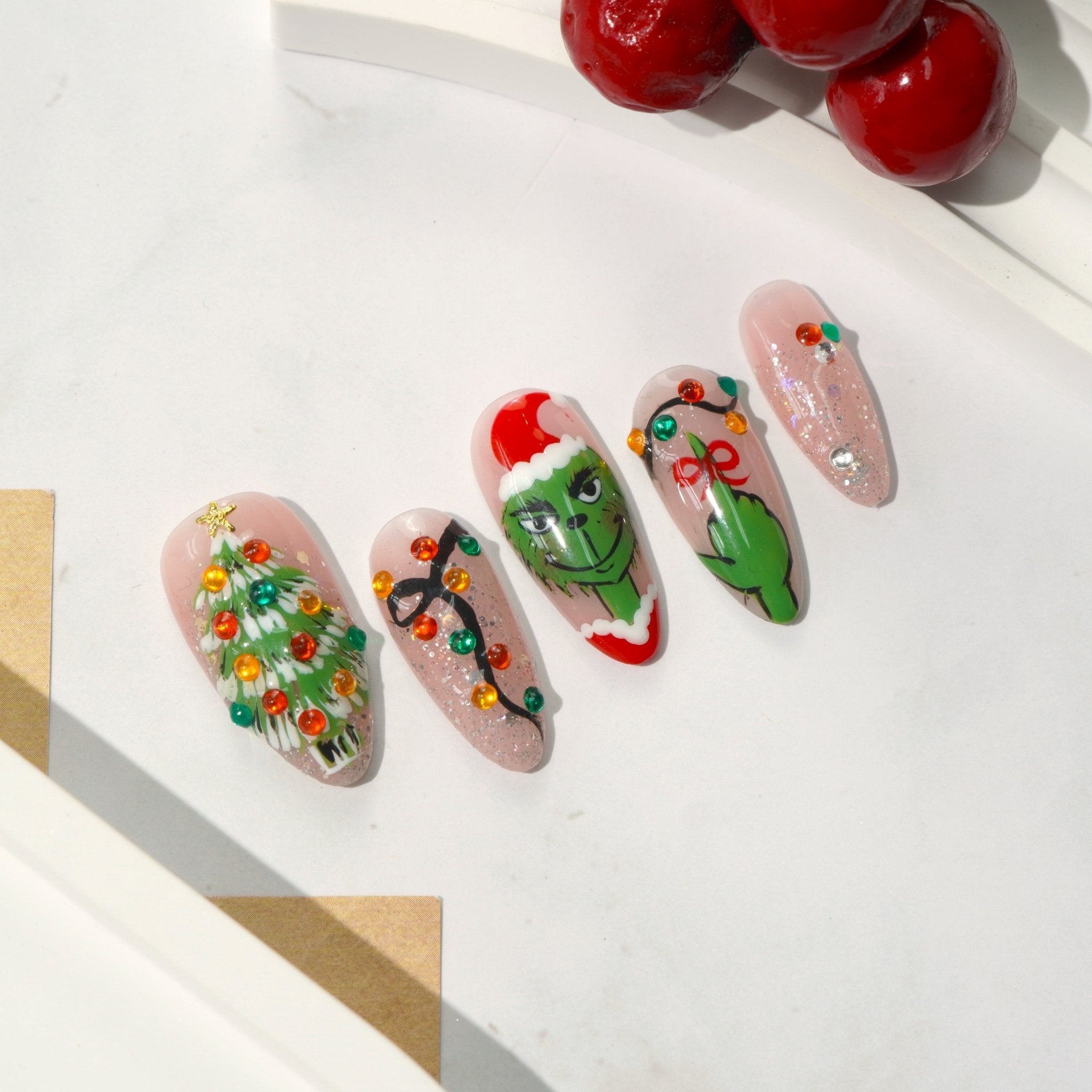 Green Lights press-on nails worn on hand – almond shape by Handora