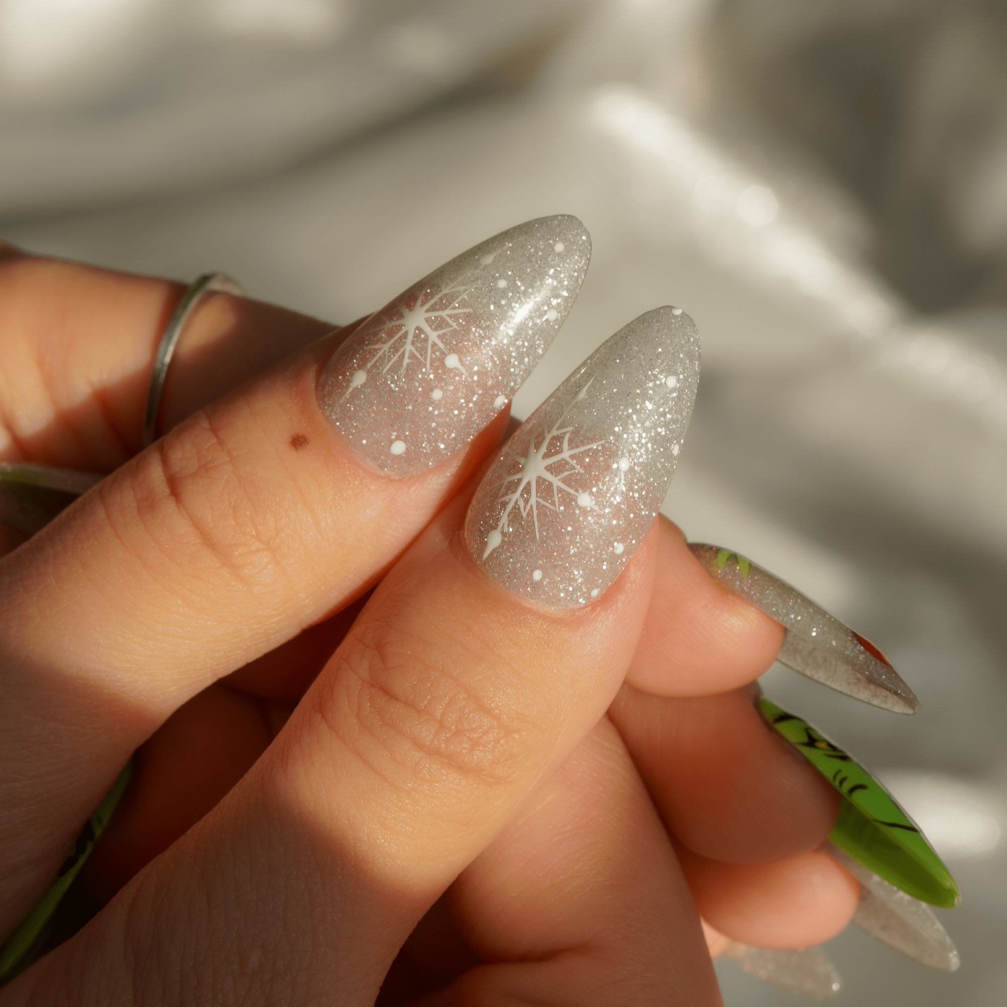 Green Sparkle almond press-on nails – design close-up by Handora