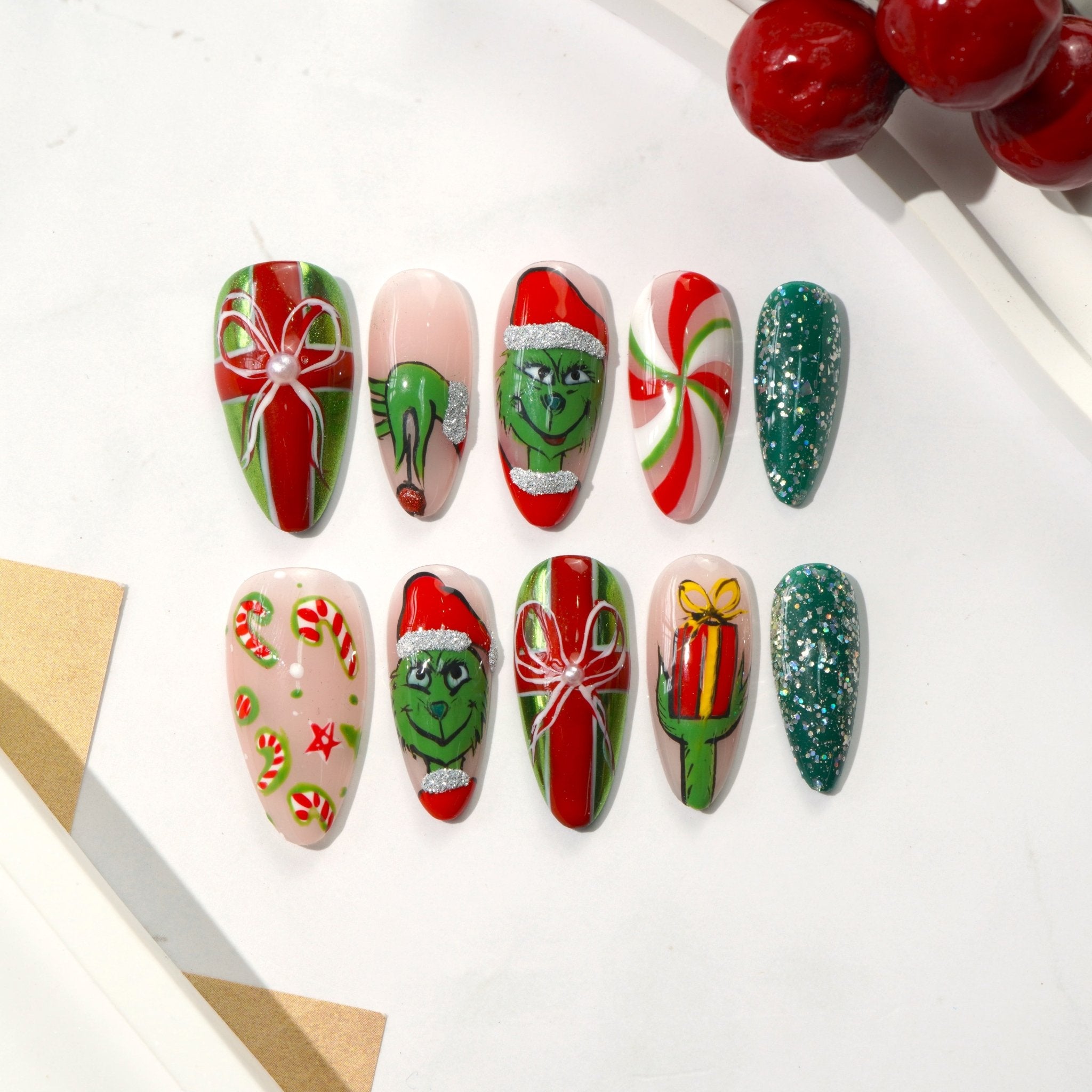 Green Xmas green almond press-on nails by Handora