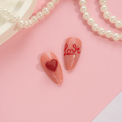 Honey Teddy press-on nails worn on hand – almond shape by Handora