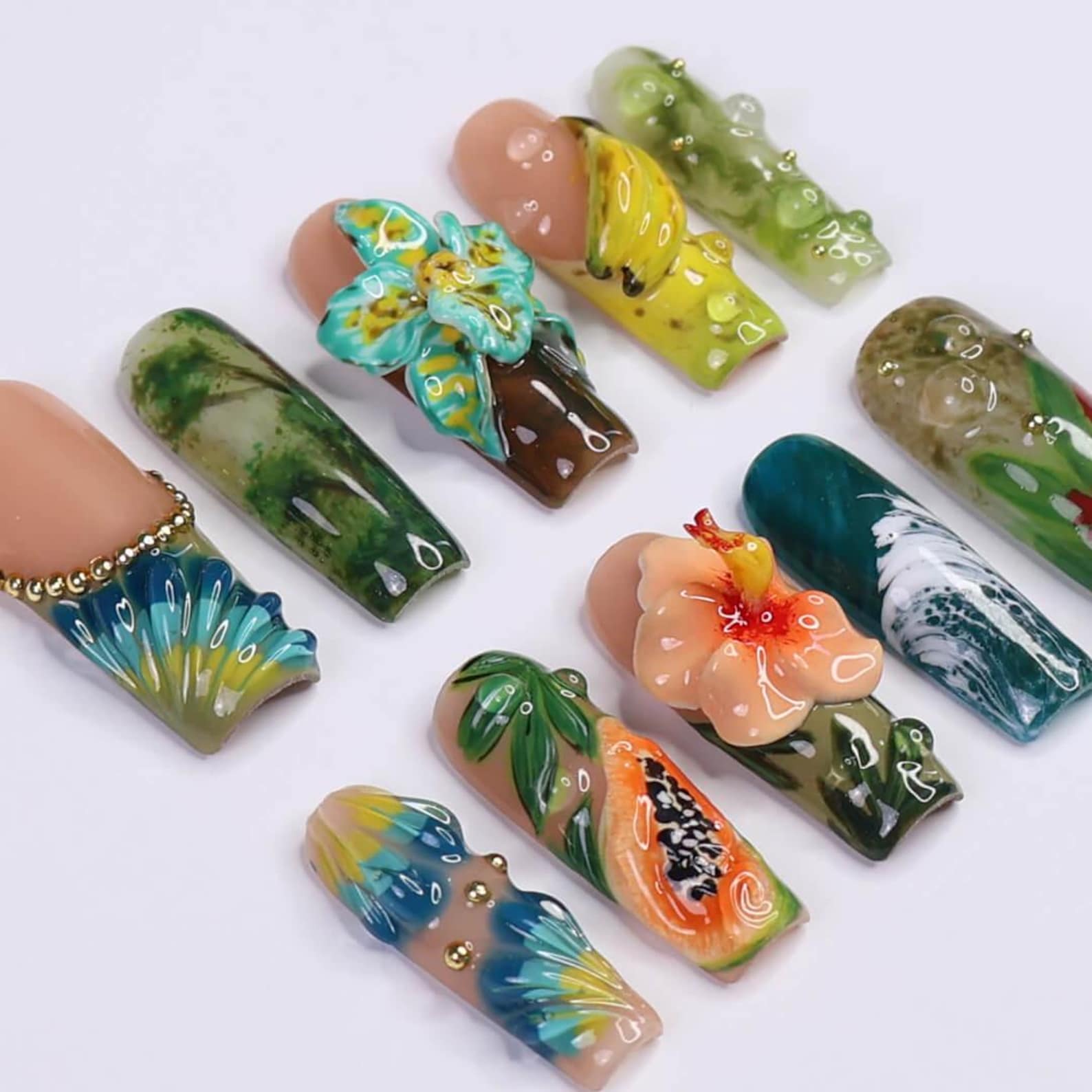Tropical Jungle press-on nails worn on hand – almond shape by Handora