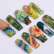 Tropical Jungle press-on nails worn on hand – almond shape by Handora