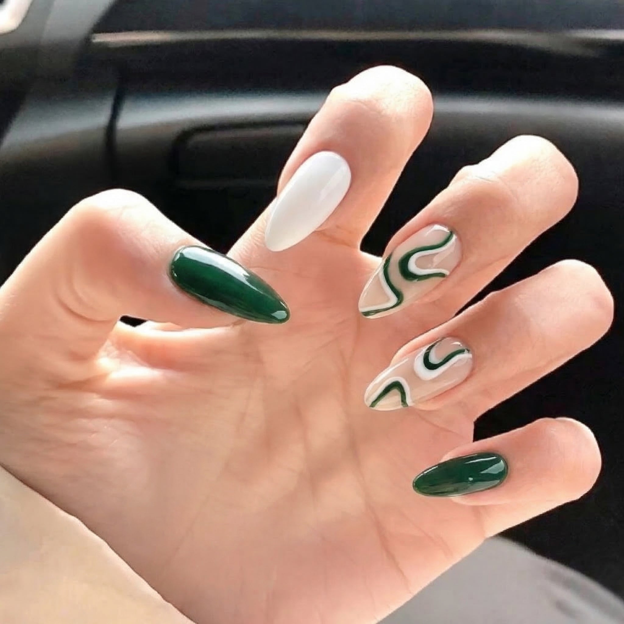 Jade Wave press-on nails worn on hand – almond shape by Handora