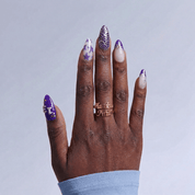 Karma's Time press-on nails worn on hand – almond shape by Handora