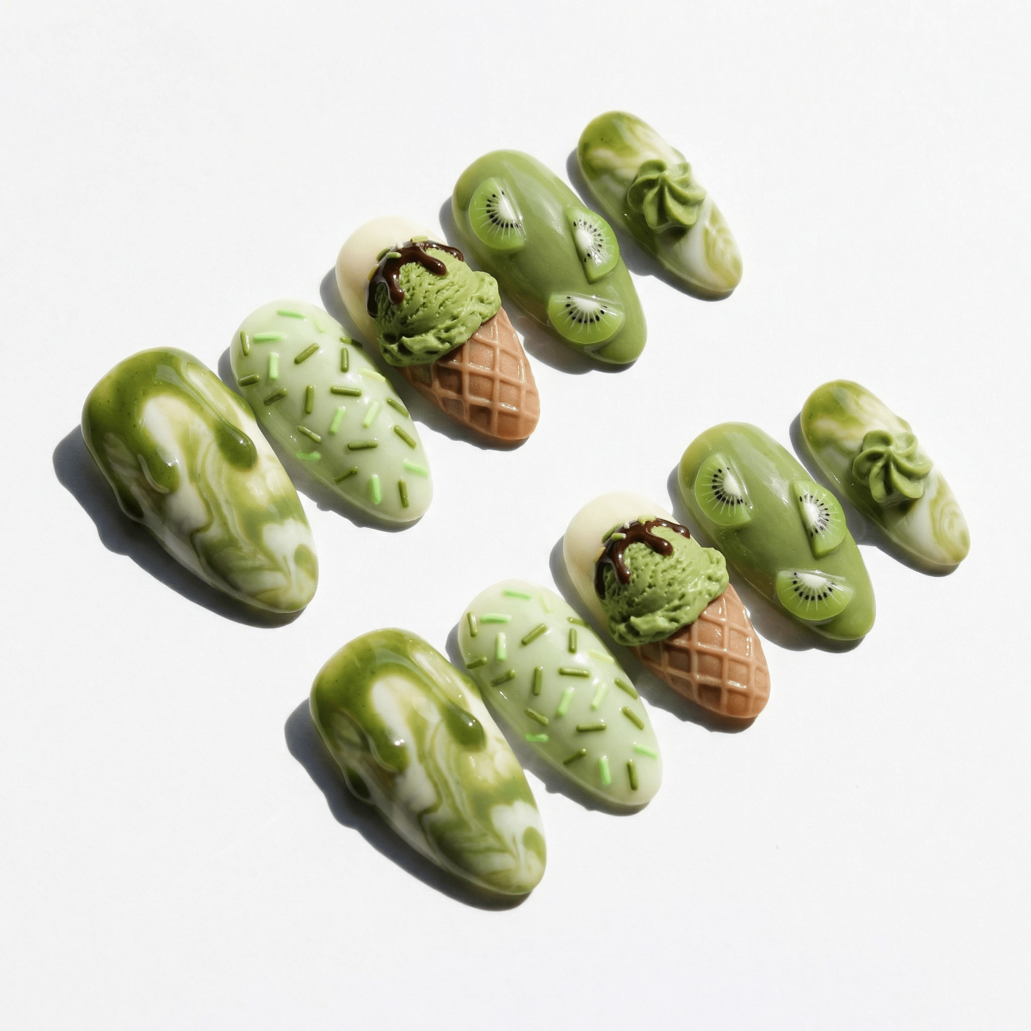 Kiwi Sundae press-on nails worn on hand – almond shape by Handora