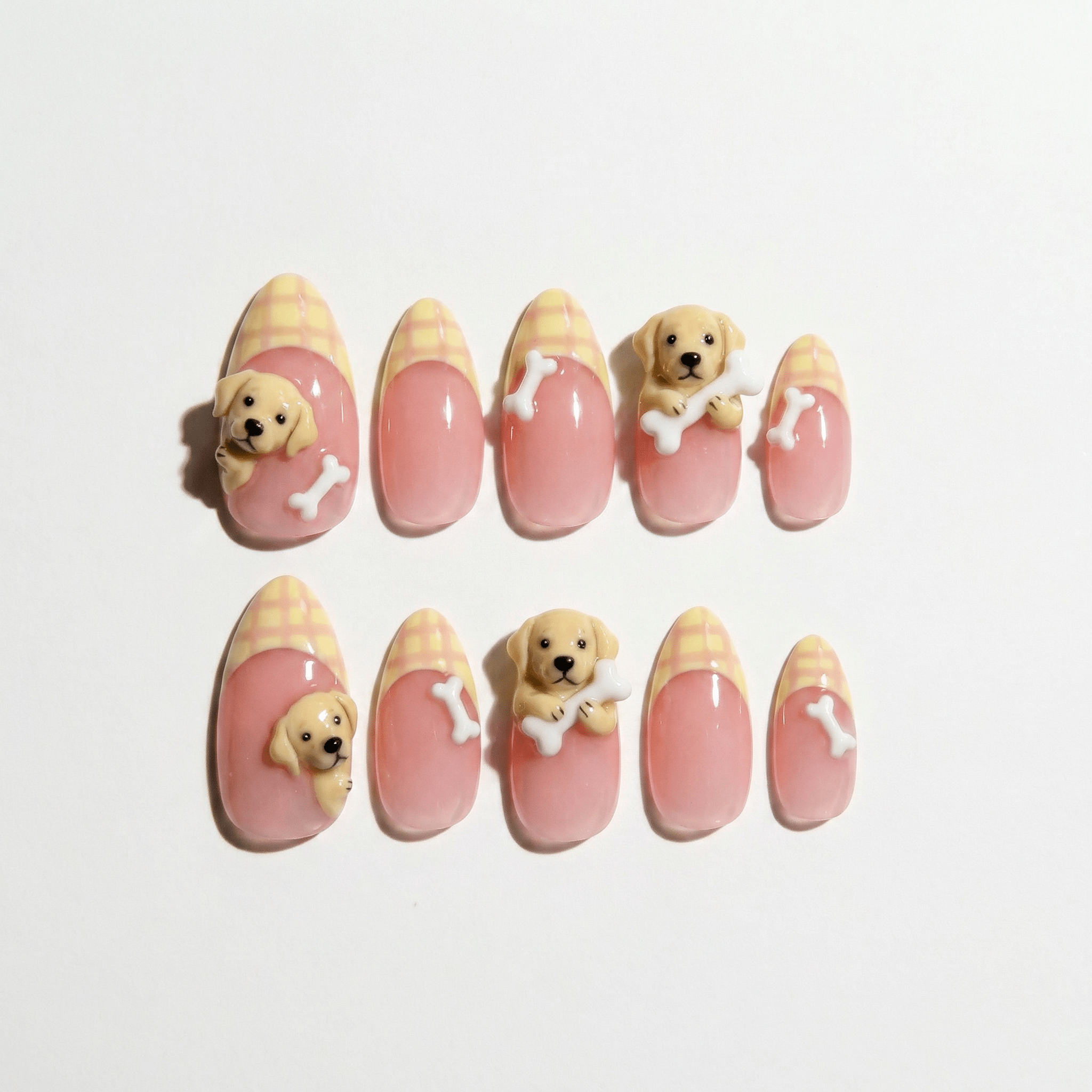 Labrador Charm press-on nails worn on hand – almond shape by Handora