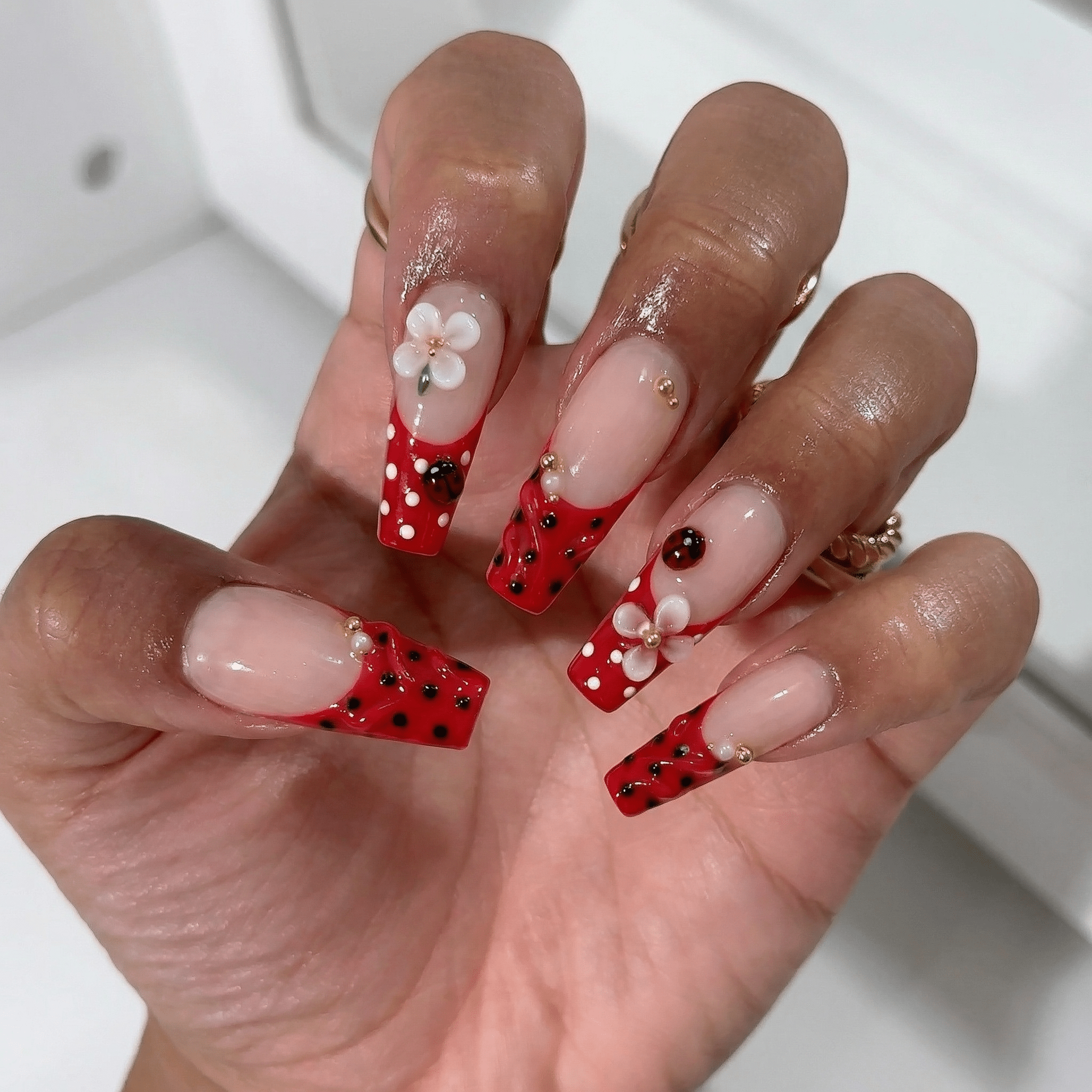 Ladybug Blossom press-on nails – hand-painted reusable gel set by Handora