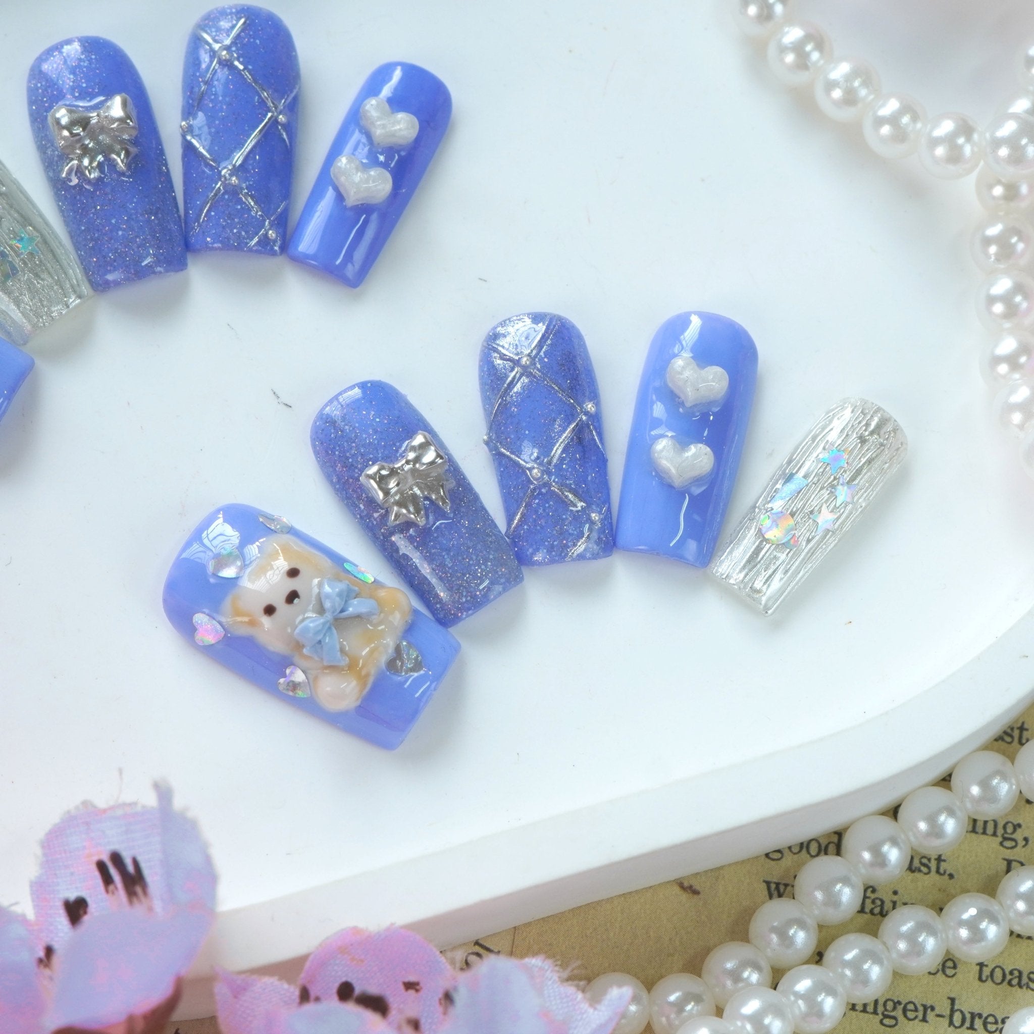 Lavender Dream press-on nails worn on hand – almond shape by Handora