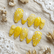 Lemon Glow press-on nails by Handora