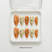 Leo Majesty press-on nails worn on hand – almond shape by Handora