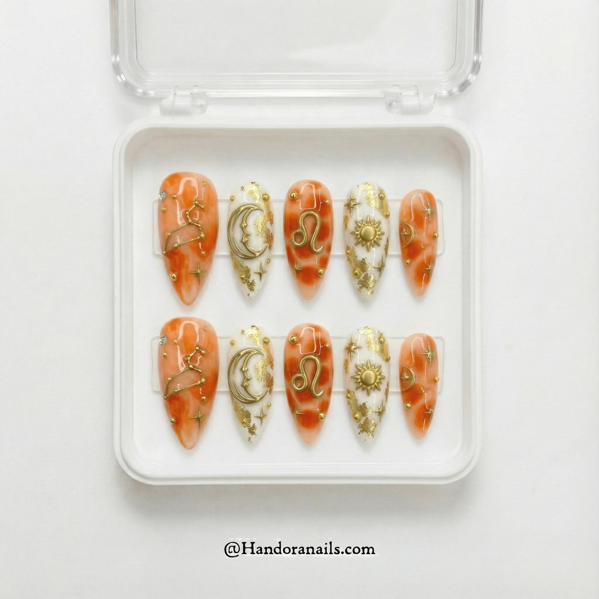Leo Majesty press-on nails worn on hand – almond shape by Handora
