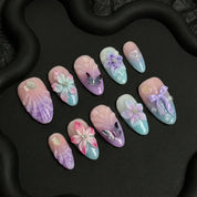 Lilac Whisper press-on nails worn on hand – almond shape by Handora