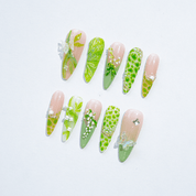 Lily Butterfly press-on nails worn on hand – almond shape by Handora