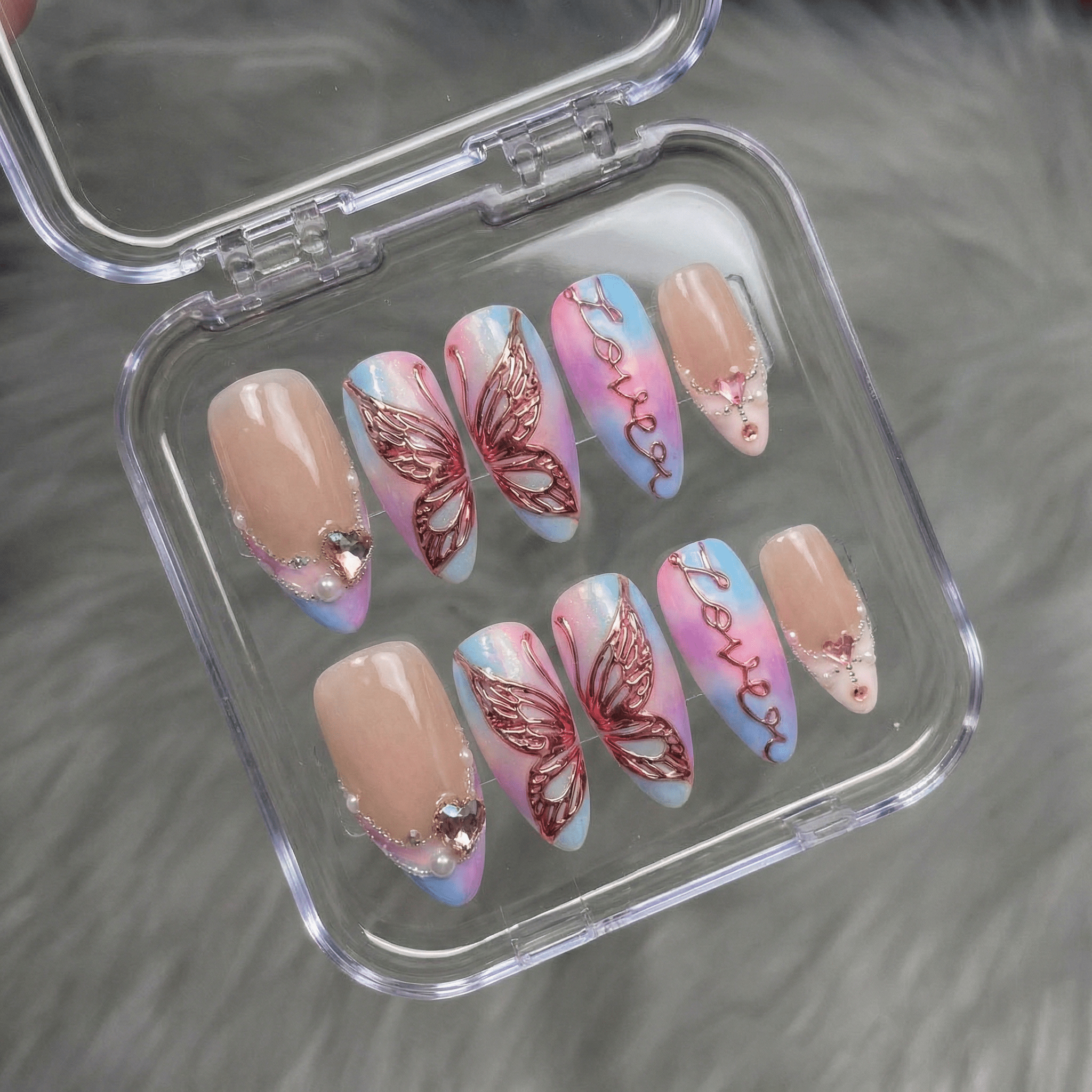 Lover press-on nails worn on hand – almond shape by Handora