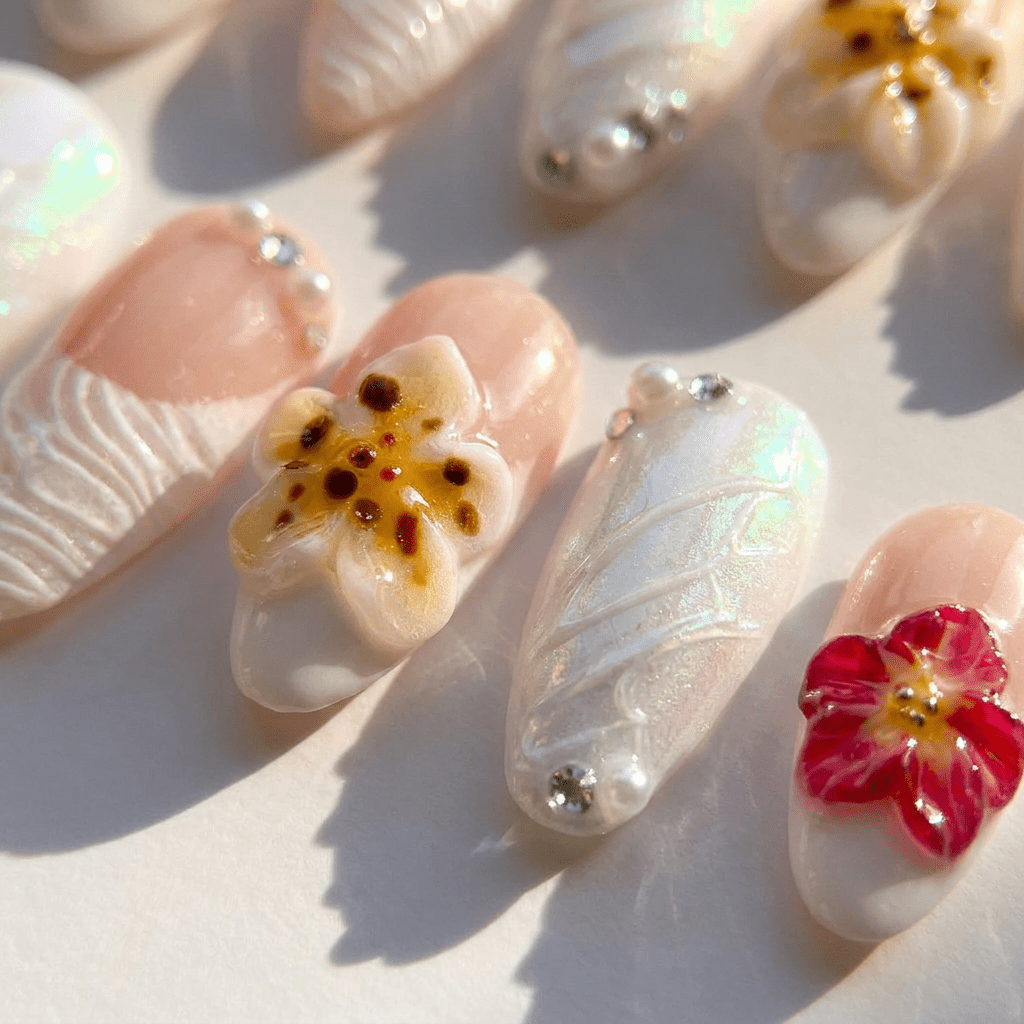Lustrous Rose press-on nails worn on hand – almond shape by Handora