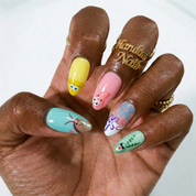 Bikini Bottom press-on nails worn on hand – almond shape by Handora