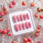 Berry Bliss press-on nails worn on hand – square shape by Handora
