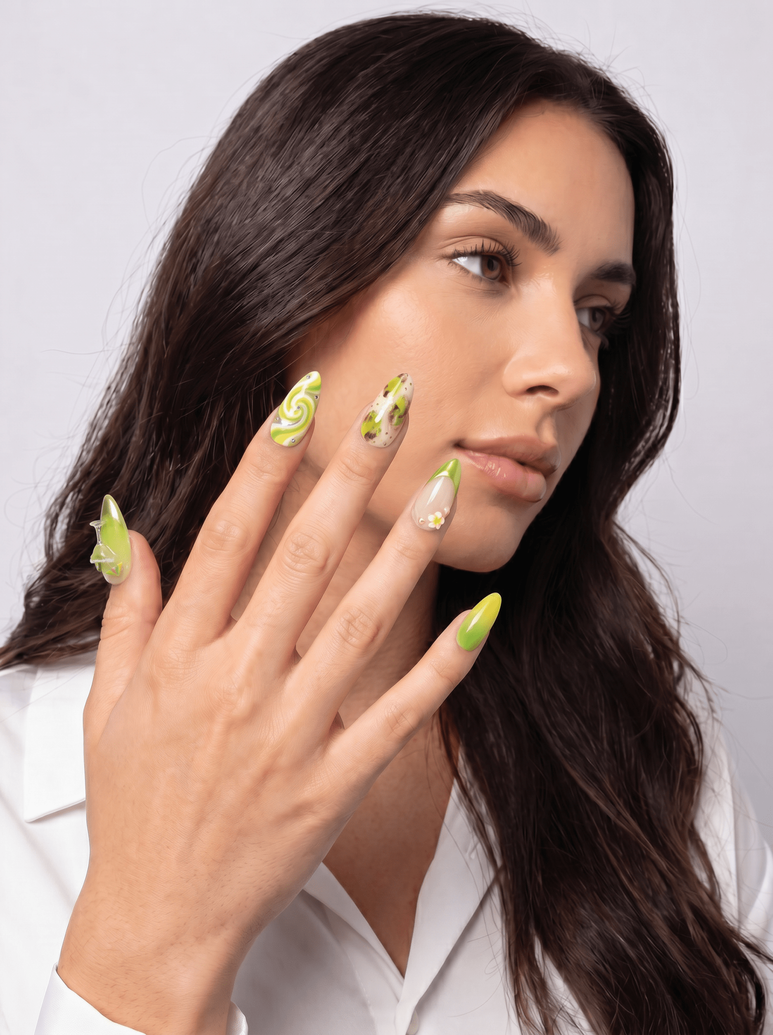 Margarita press-on nails worn on hand – almond shape by Handora