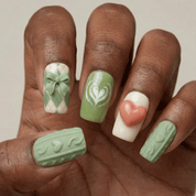 Matcha Knit press-on nails worn on hand – almond shape by Handora