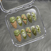 Matcha Swirl press-on nails worn on hand – almond shape by Handora