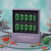 Melon Splash press-on nails worn on hand – almond shape by Handora