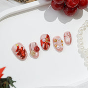 Merry Glow press-on nails – hand-painted reusable gel set by Handora