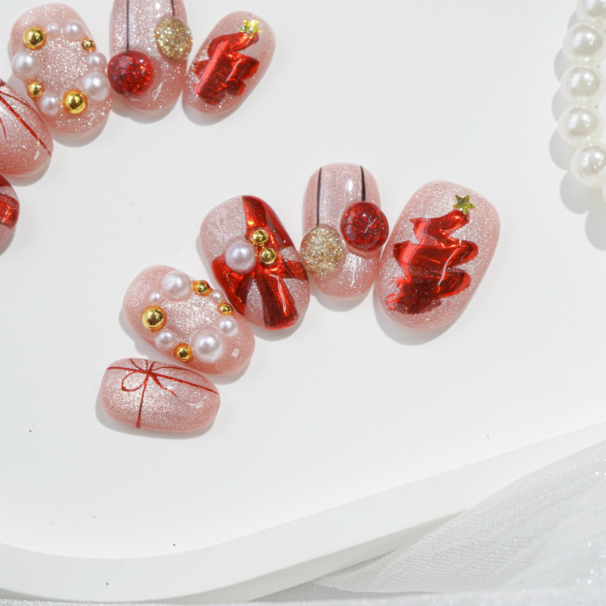 Merry Glow press-on nails worn on hand – almond shape by Handora