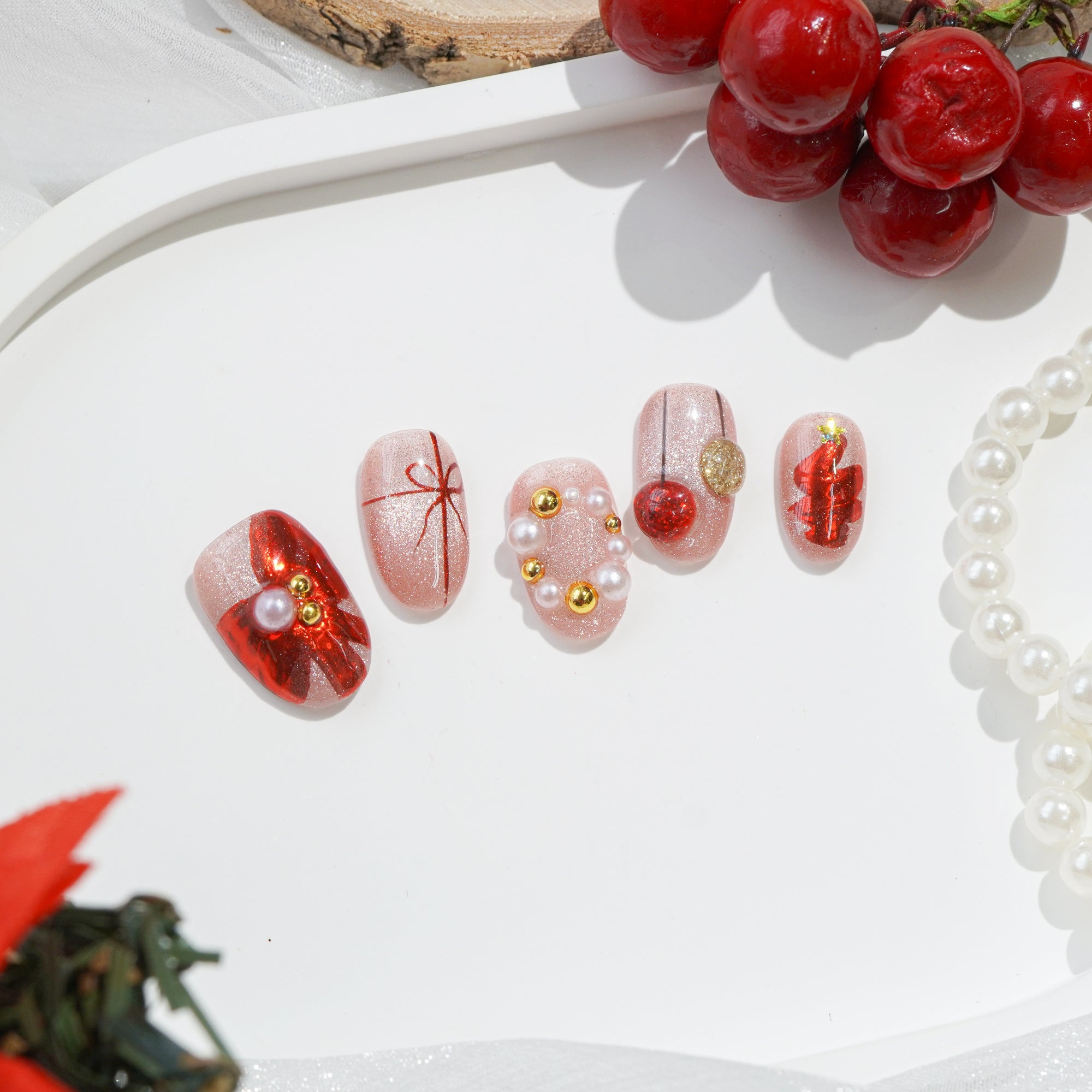 Merry Glow almond press-on nails – design close-up by Handora
