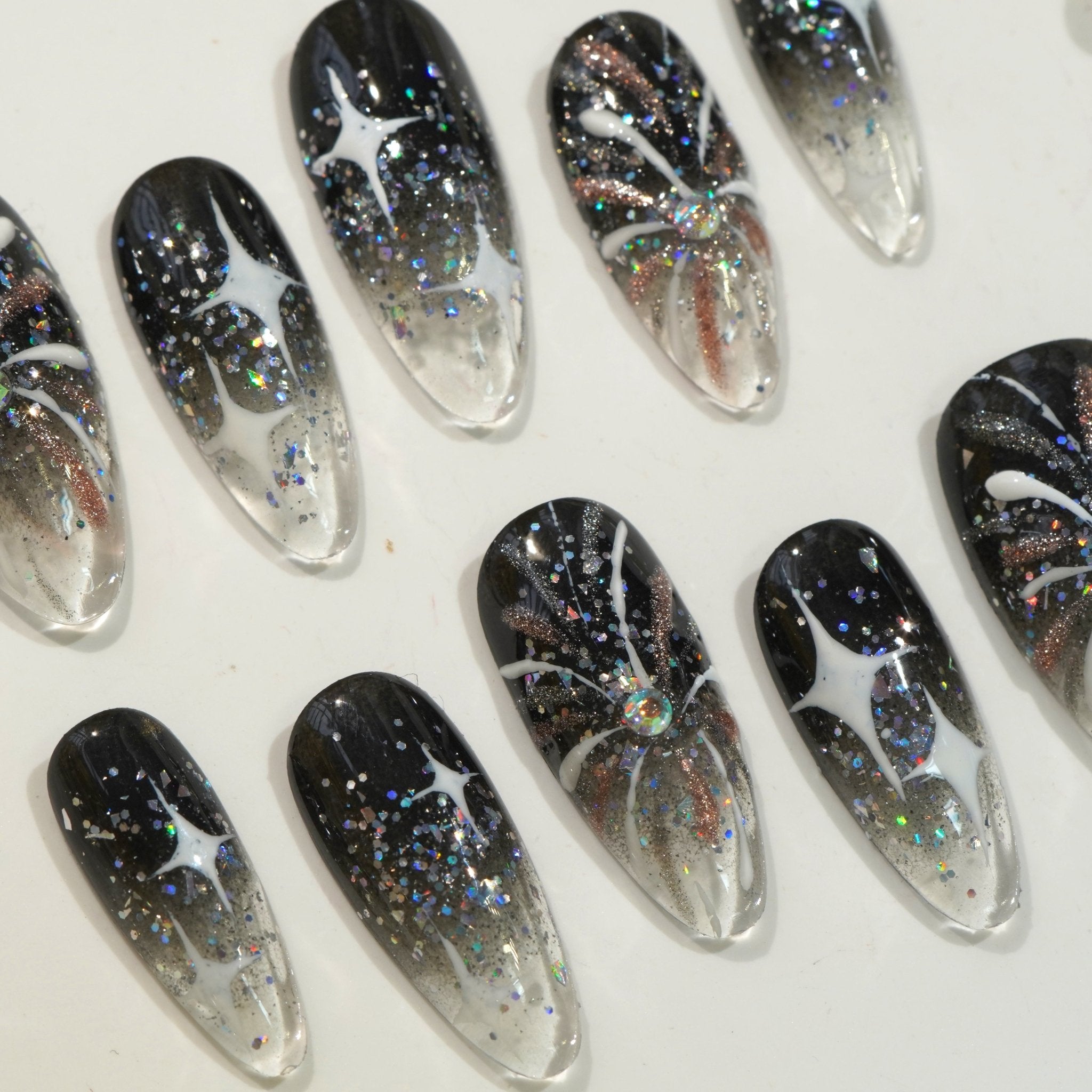 Midnight Aura press-on nails worn on hand – almond shape by Handora