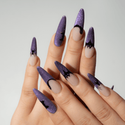 Midnight Web press-on nails worn on hand – almond shape by Handora