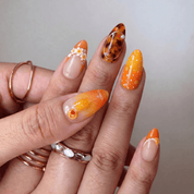 Mimosa press-on nails worn on hand – almond shape by Handora