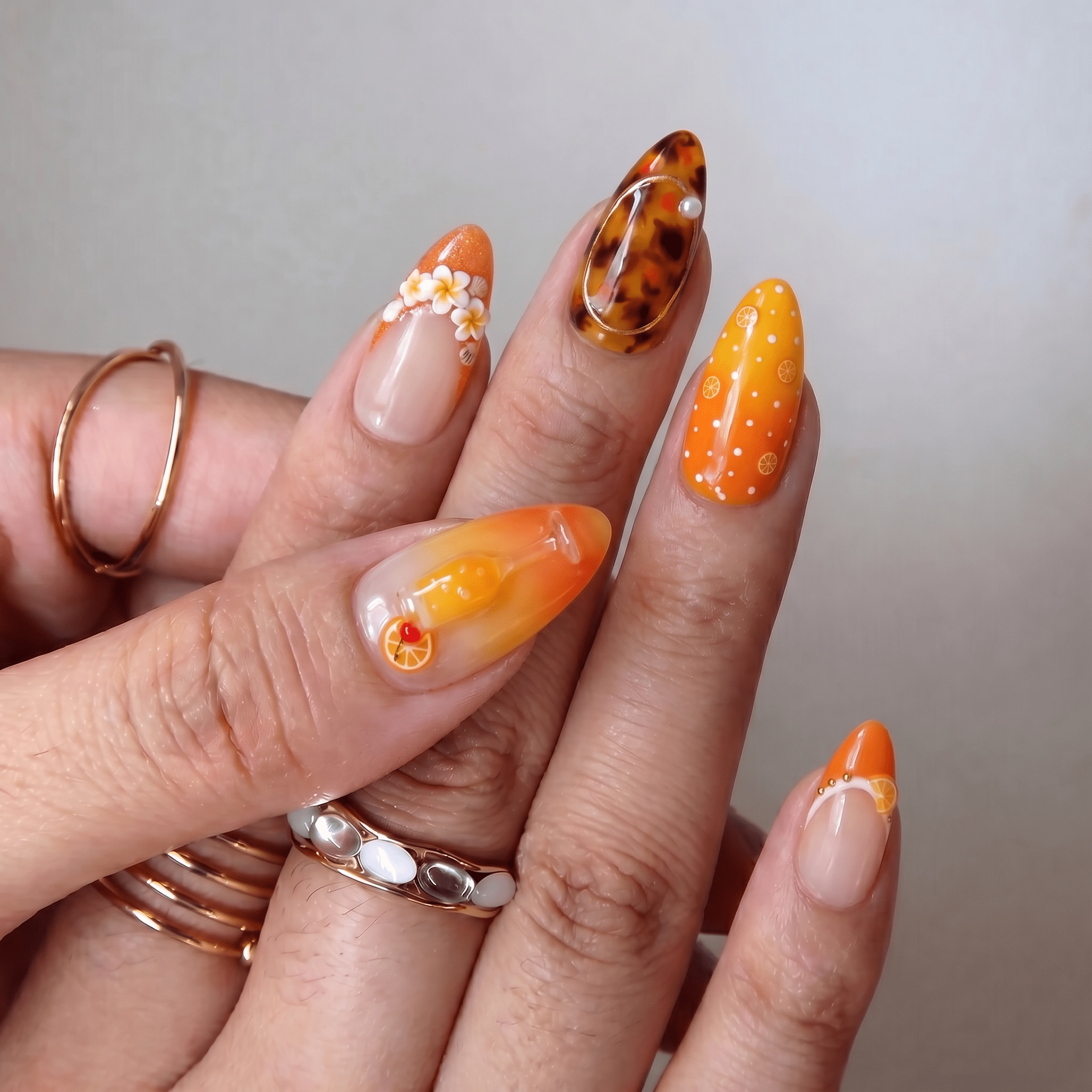Mimosa press-on nails worn on hand – almond shape by Handora