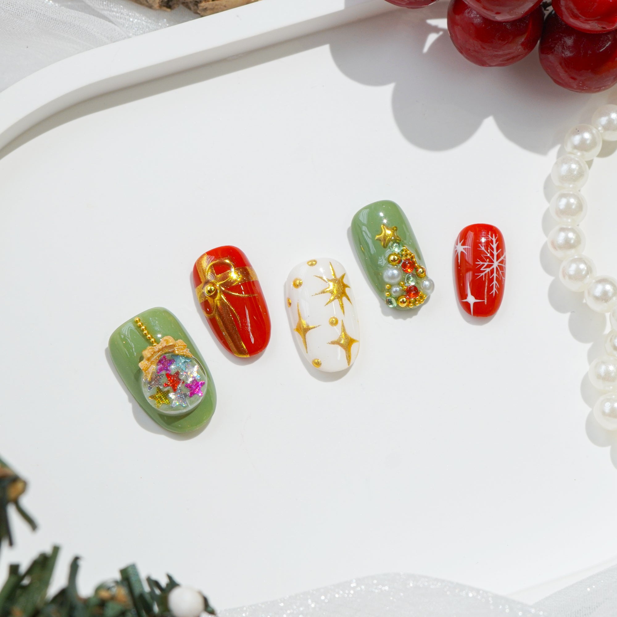 Mistletoe Magic oval press-on nails – design close-up by Handora