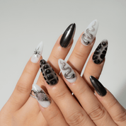 Mystic Fang press-on nails worn on hand – almond shape by Handora