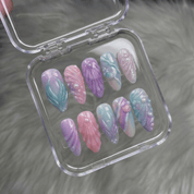 Mystic Mermaid press-on nails worn on hand – almond shape by Handora
